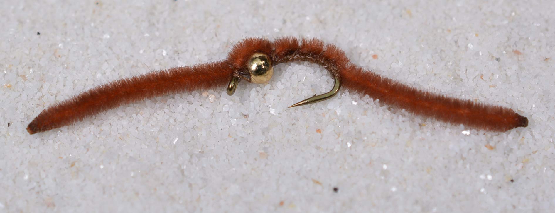 Region Fishing tungsten bead San Juan Worm on Mustad hook optimizes nymphing accuracy.