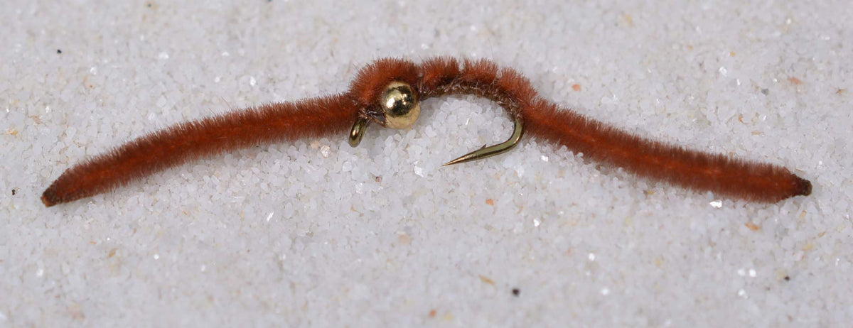Region Fishing tungsten bead San Juan Worm on Mustad hook optimizes nymphing accuracy.