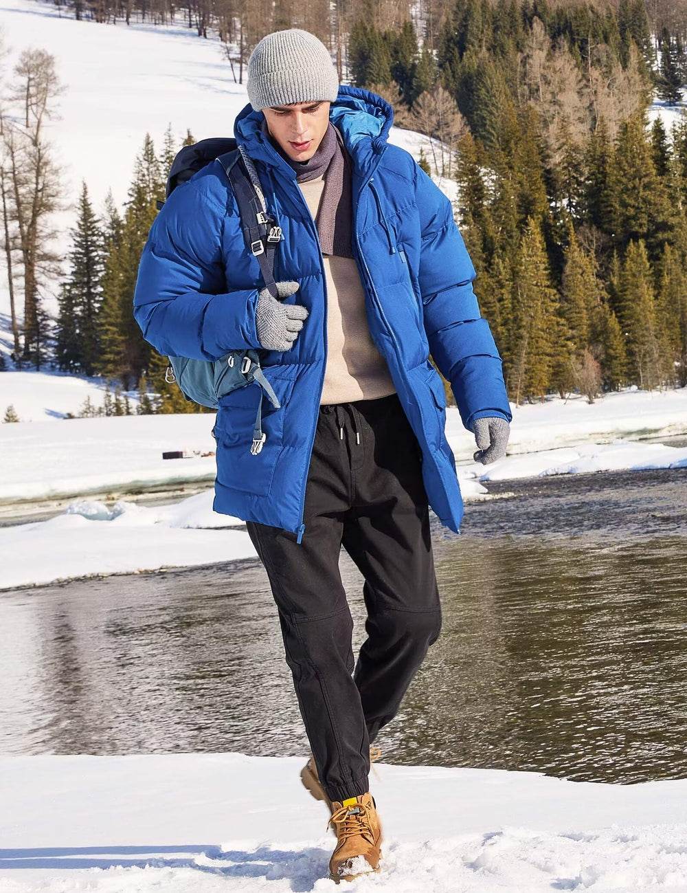 Rejork royal blue parka in snowy setting showcasing casual wear versatility.