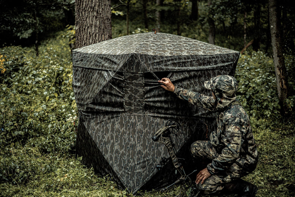 Rhino Outdoors see-through blind enables broad perimeter awareness.