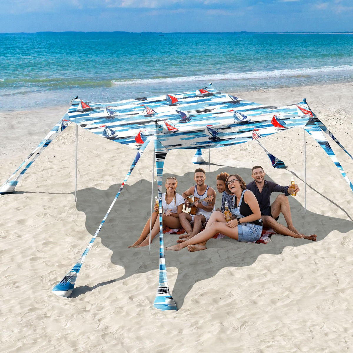 Rhino Valley Beach Tent 10x10 blue sailboat setup provides quick shade for family beach days.