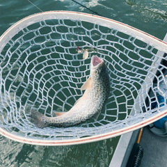 RHINR fly fishing net with clear rubberized material protects fish.