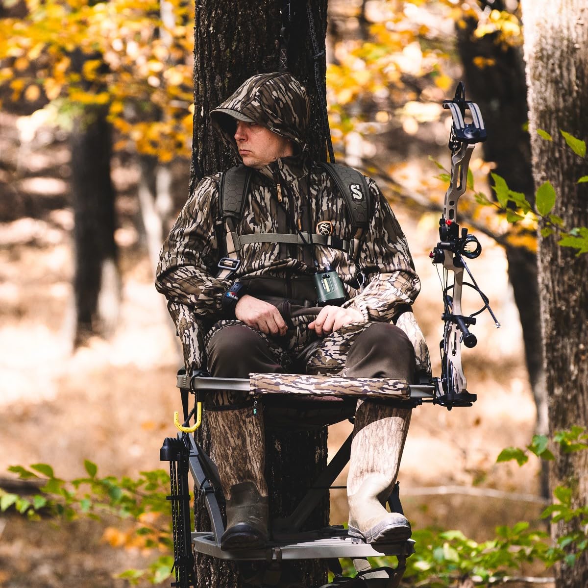 Seat lowered with front bar used as a gun rest for rifle hunting