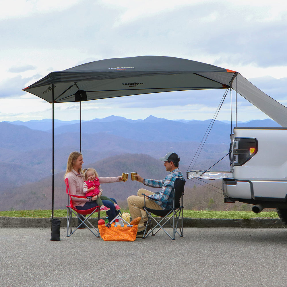 Rightline Gear blue-tailgate-canopy-use-case-camping demonstrates outdoor shade at campground.