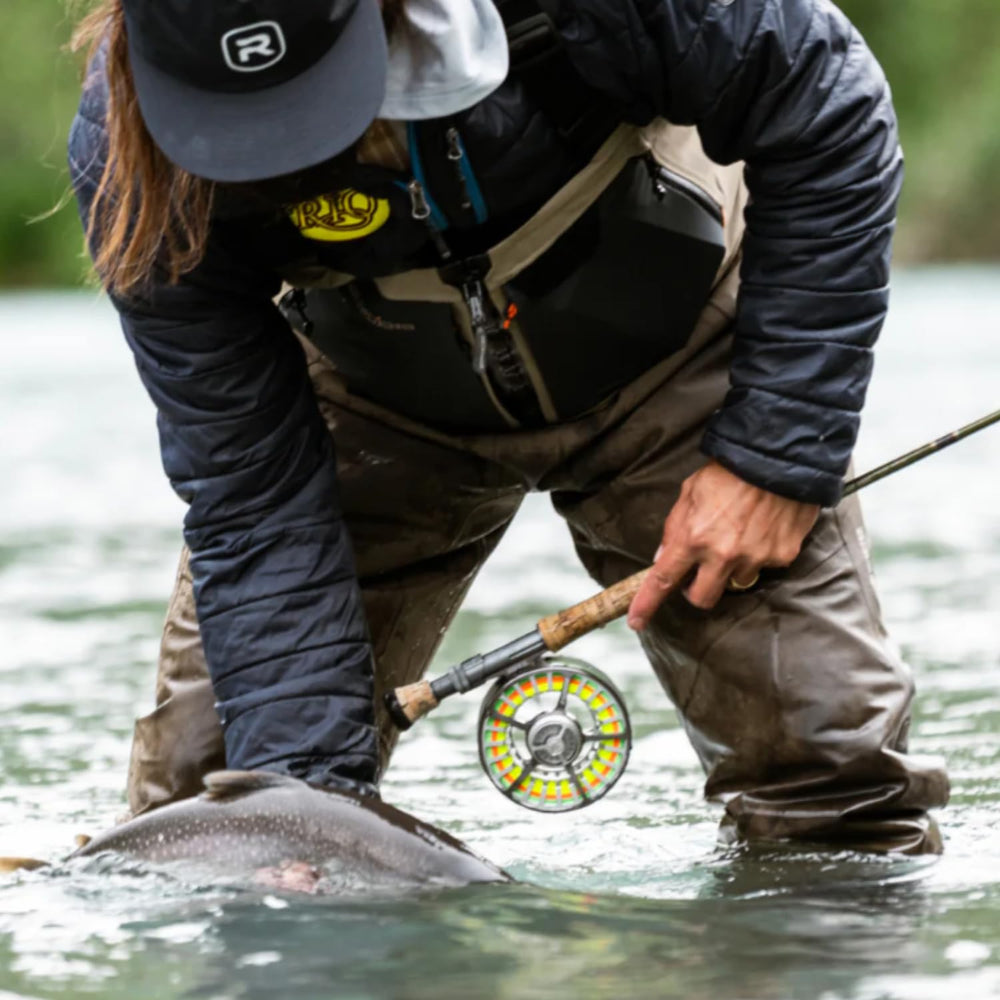 RIO Mainstream Trout DT3F Lemon Green wade-casting on a stream shows controlled presentations.