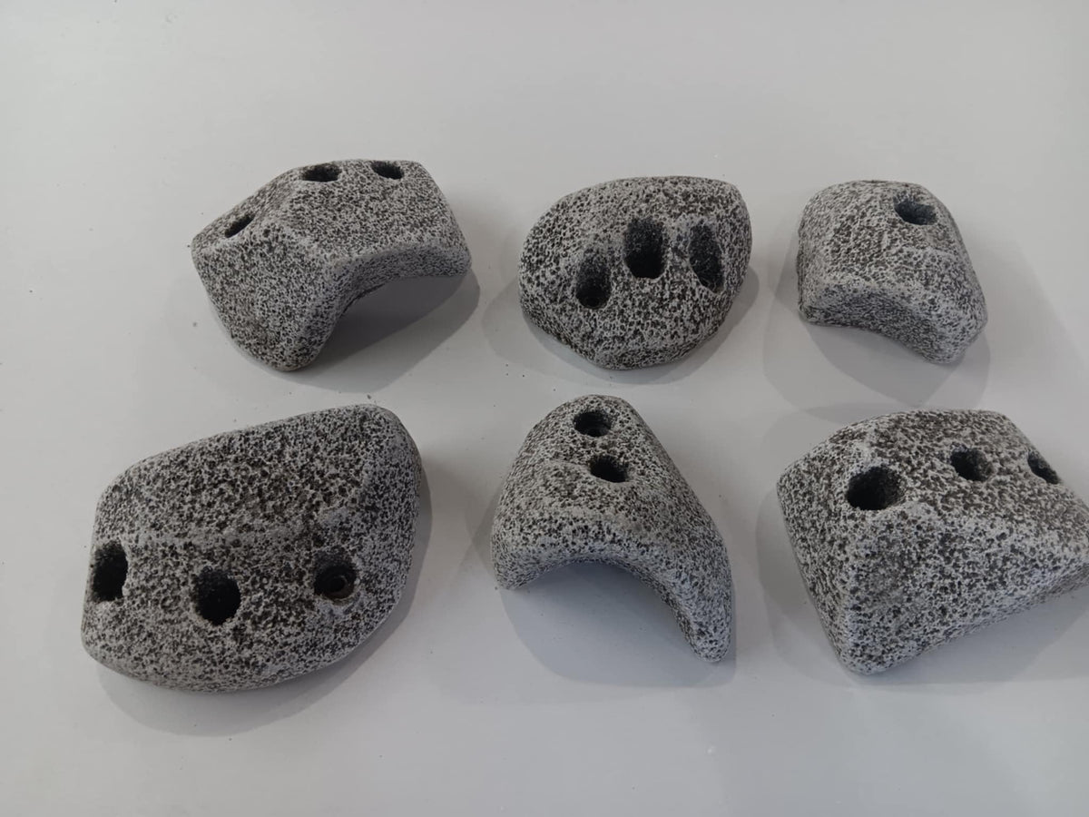 Rocky Mountain Holds granite texture demonstrates authentic grip for indoor climbing.