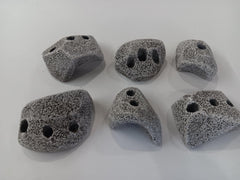 Rocky Mountain Holds granite texture demonstrates authentic grip for indoor climbing.
