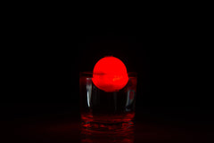 Rod-N-Bobb's Glow Bobber illuminated on water for easy bite detection.
