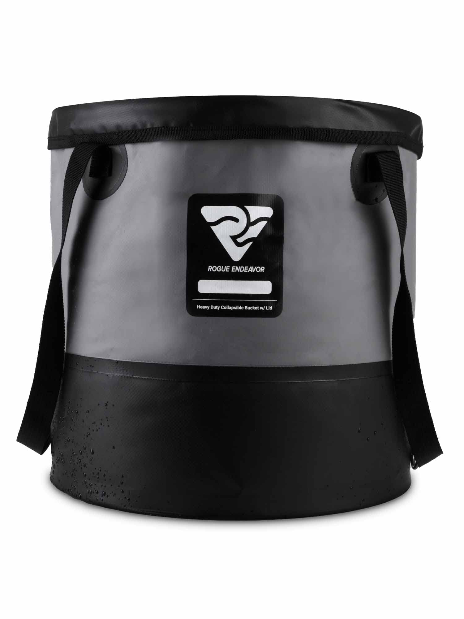 Rogue Endeavor collapsible bucket in use near water for camping and cleaning tasks.