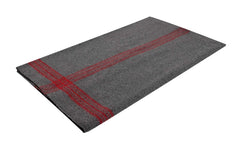 Rothco striped outdoor wool blanket packed with gear for versatile outdoor warmth.