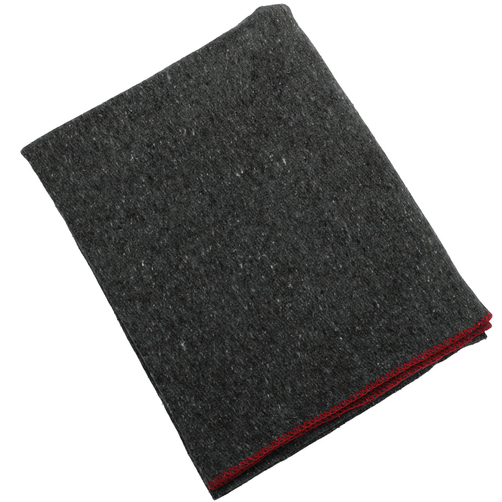 Rothco Wool Rescue Blanket demonstrates fire-retardant feature for outdoor safety.