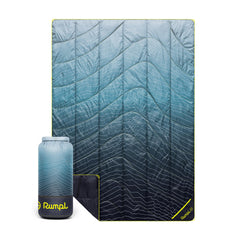 Rumpl Backcountry Puffy Blanket Moraine Mist folded in roll-top bag for easy transport