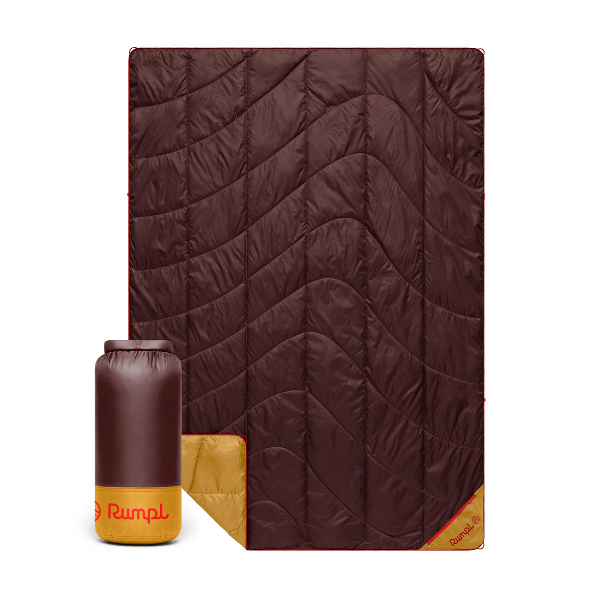 Rumpl Backcountry Puffy Blanket rolled in rolltop carry bag for easy transport