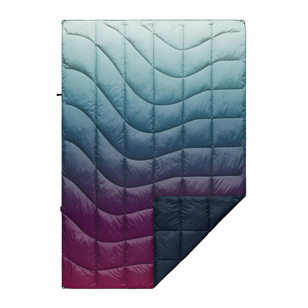 Rumpl Nanoloft Puffy Blanket Crisp Fade folded for compact warmth on camping trips
