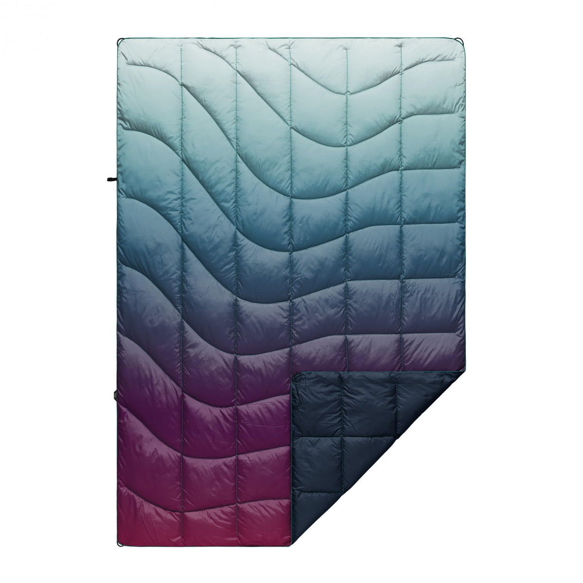 Rumpl Nanoloft Puffy Blanket Crisp Fade folded for compact warmth on camping trips