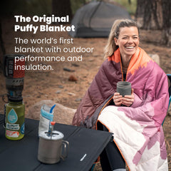 Rumpl Original Puffy Blanket laid flat shows 52 by 75 inches.