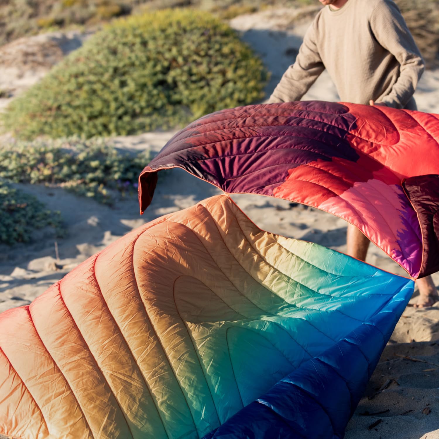 Rumpl Original Puffy Blanket cascade fade colorway adds style to camping trips.