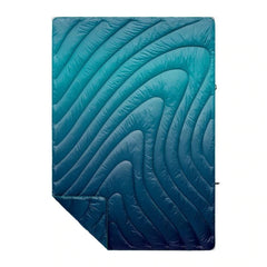 Rumpl Original Puffy Blanket Ocean Fade folded for compact storage and portability