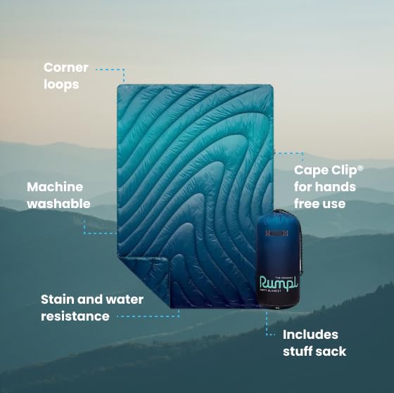 Rumpl Original Puffy Blanket Ocean Fade on campsite for warmth