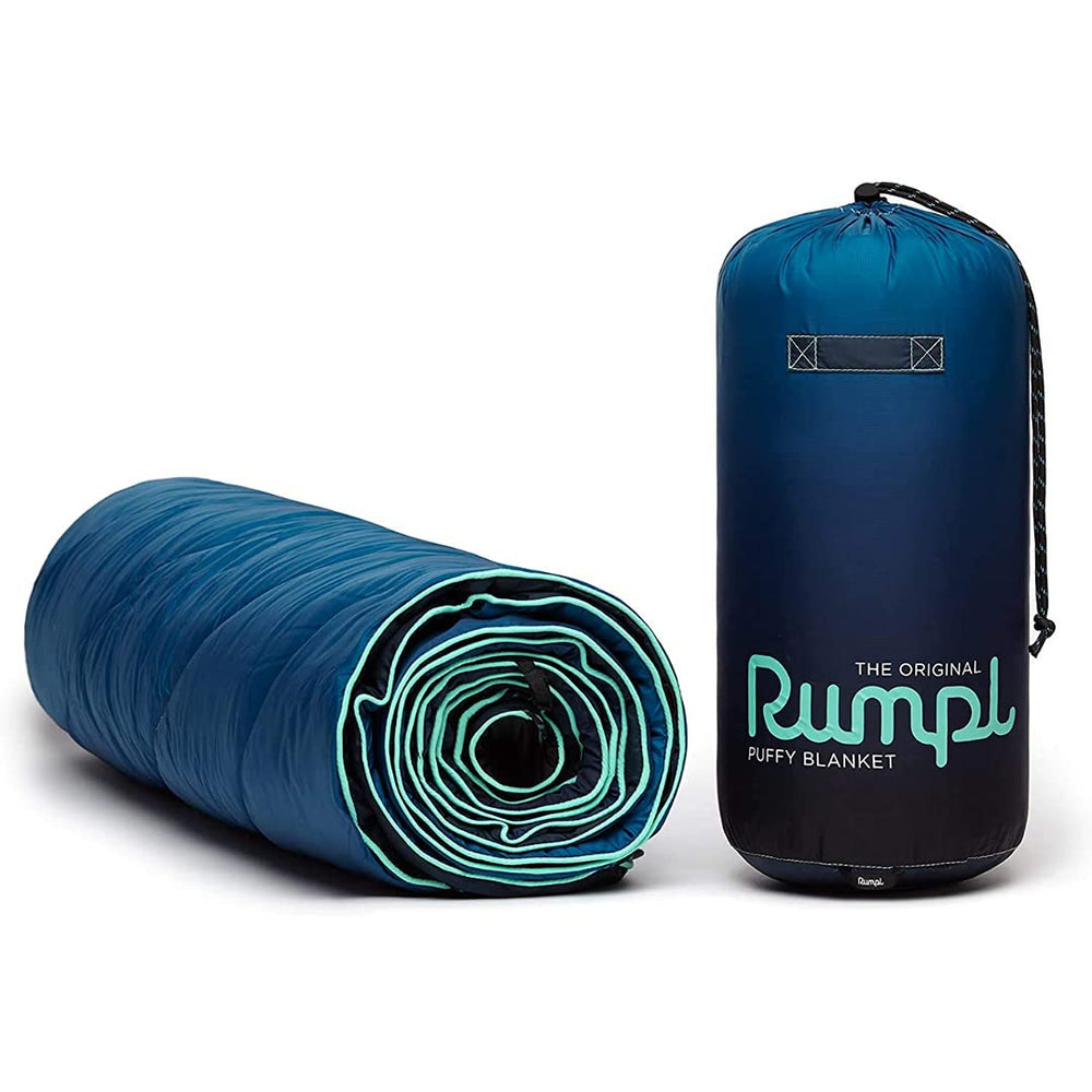 Rumpl Original Puffy Blanket Ocean Fade packed for easy backpack trips