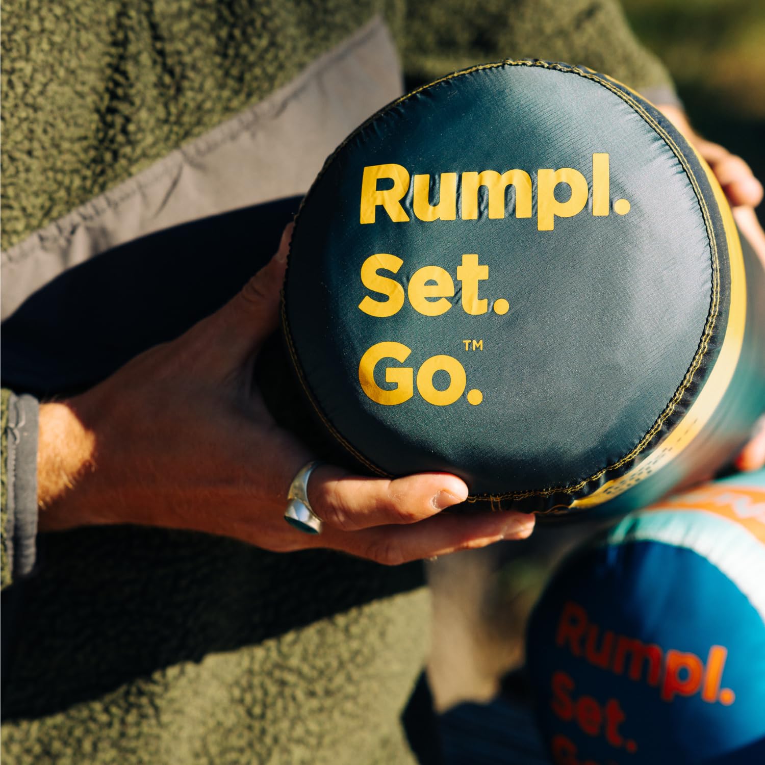 Rumpl Original Puffy Blanket compact packable carry bag for easy transport.