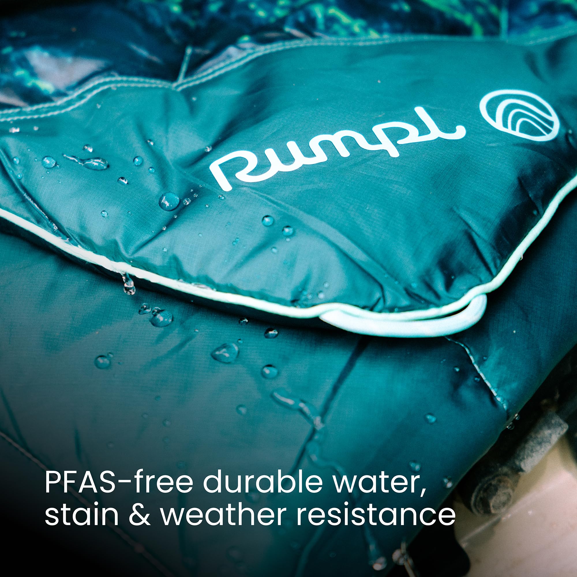 Rumpl Original Puffy Blanket rolled pack with stuff sack for easy travel.