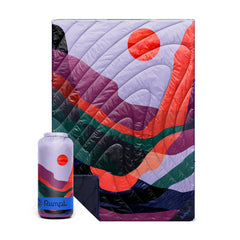 Rumpl Original Puffy Blanket Valley Dusk laid flat for campsite warmth.