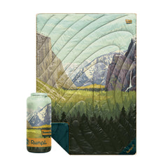 Rumpl Original Puffy Yosemite blanket packed in its bag for portable warmth on the trail.