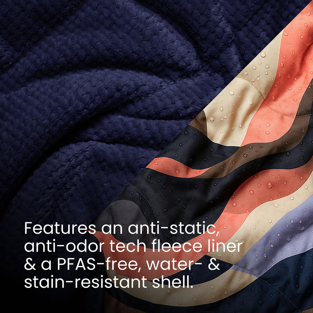 Rumpl Valley Dawn blanket packed in roll-top sack for portability