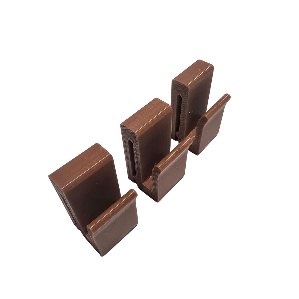 Saddle Hunting Molle Clip Set of 3 brown clips securing gear on a saddle.