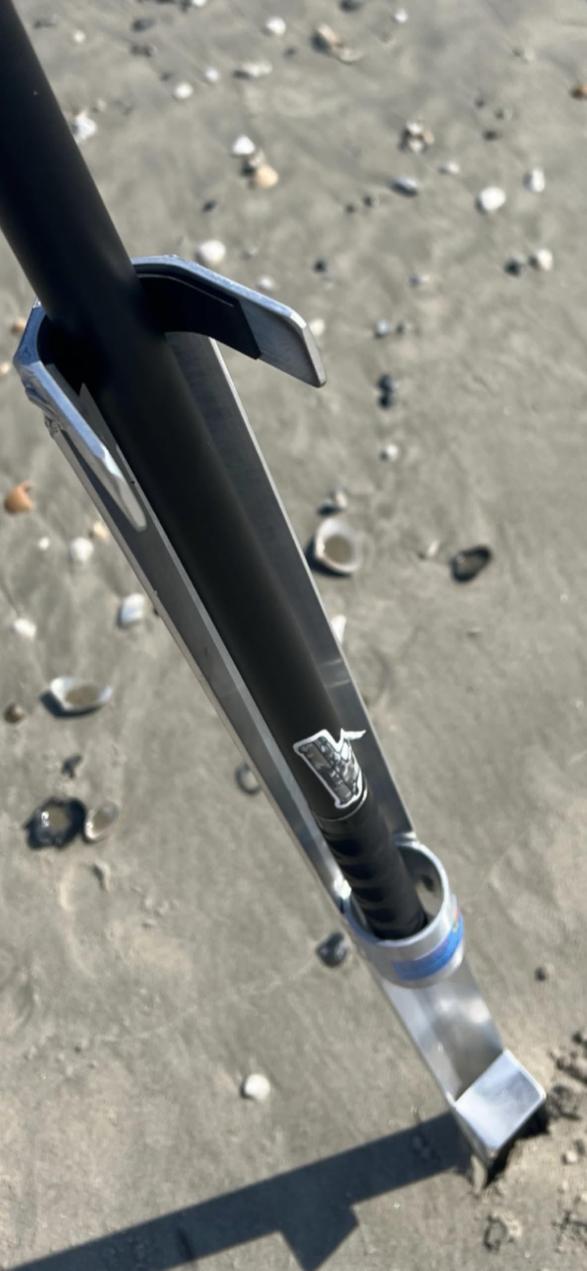 Sand Spike aluminum open-face rod holder on the beach for quick rod placement