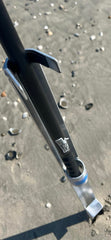Sand Spike aluminum open-face rod holder on the beach for quick rod placement