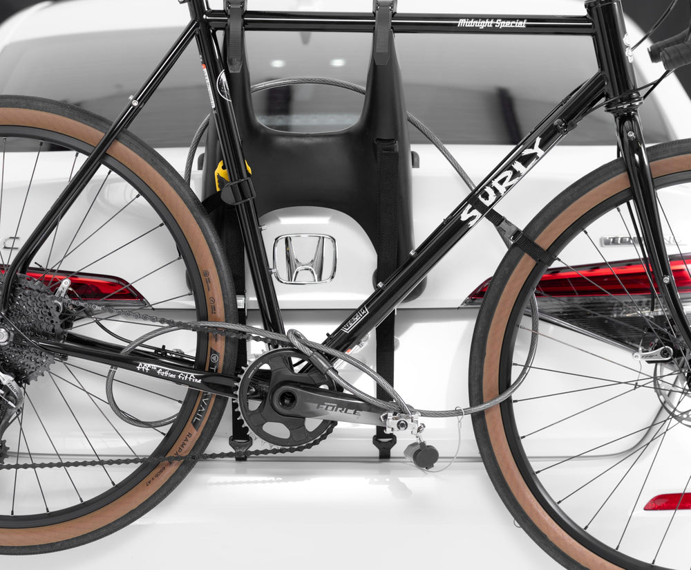 Easy-to-use Saris trunk rack lock for quick securing of gear.
