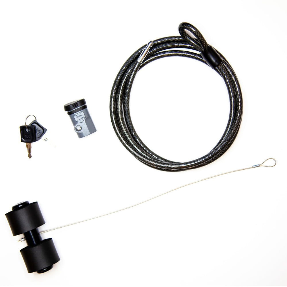 User securing a bike to a vehicle with Saris trunk rack lock.
