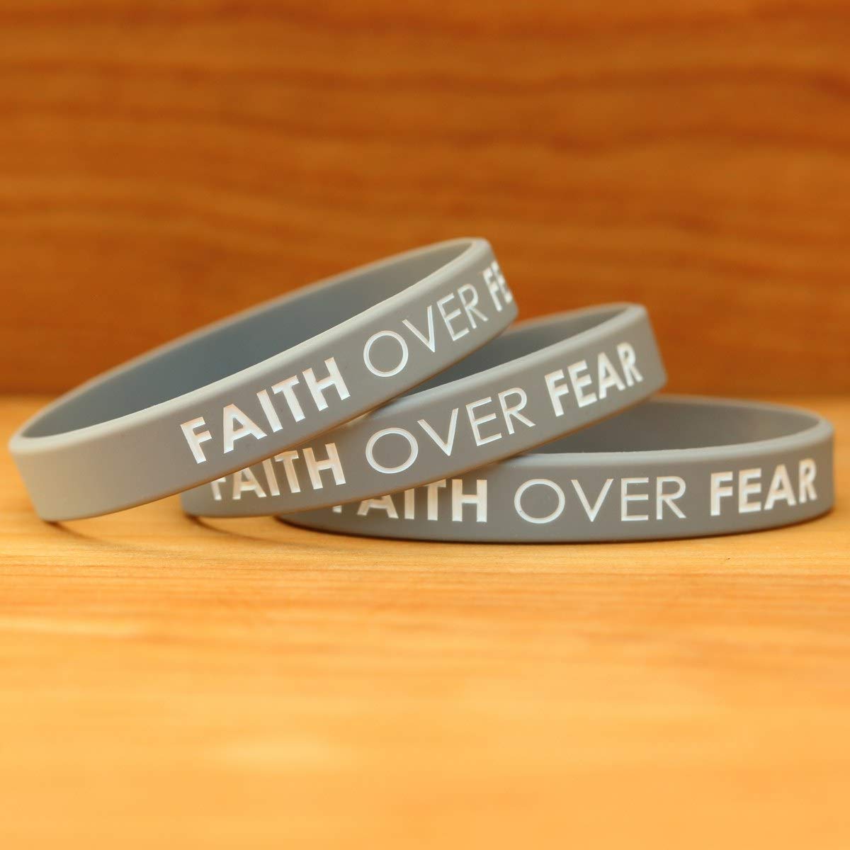 SayitBands Faith Over Fear wristband worn on the wrist during activity