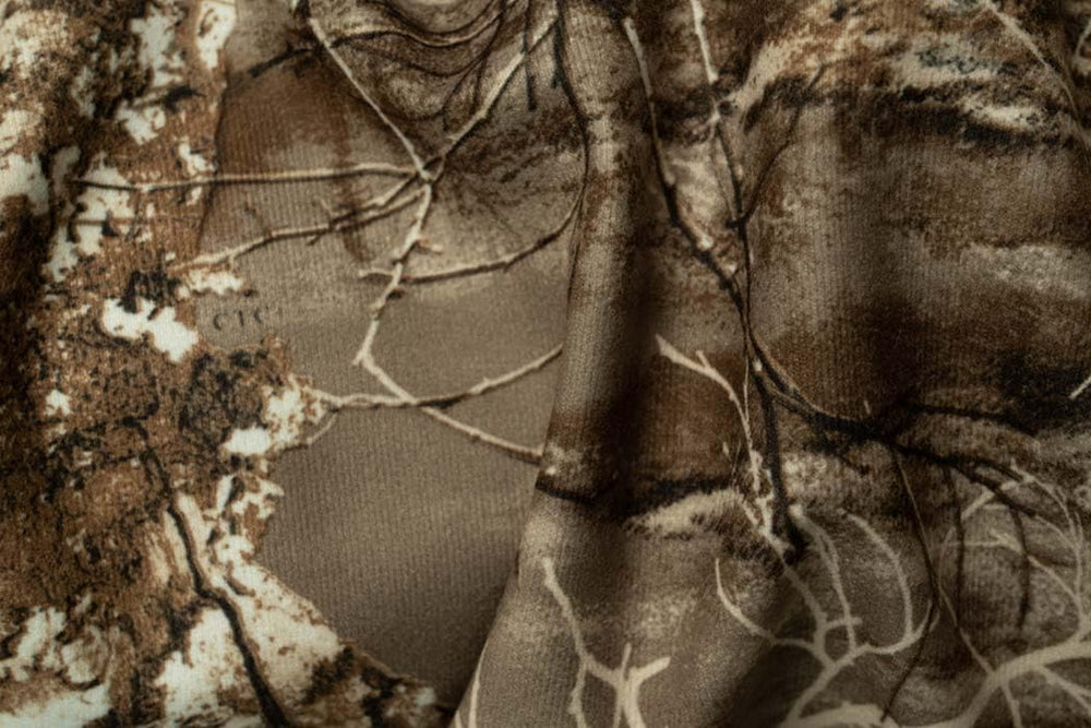 SCENTBLOCKER Drencher pants in action on tree stand for versatility.