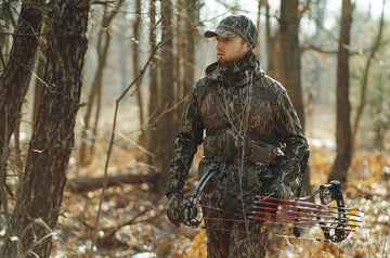SCENTBLOCKER Shield Series Silentec pants in the woods ready for hunting.