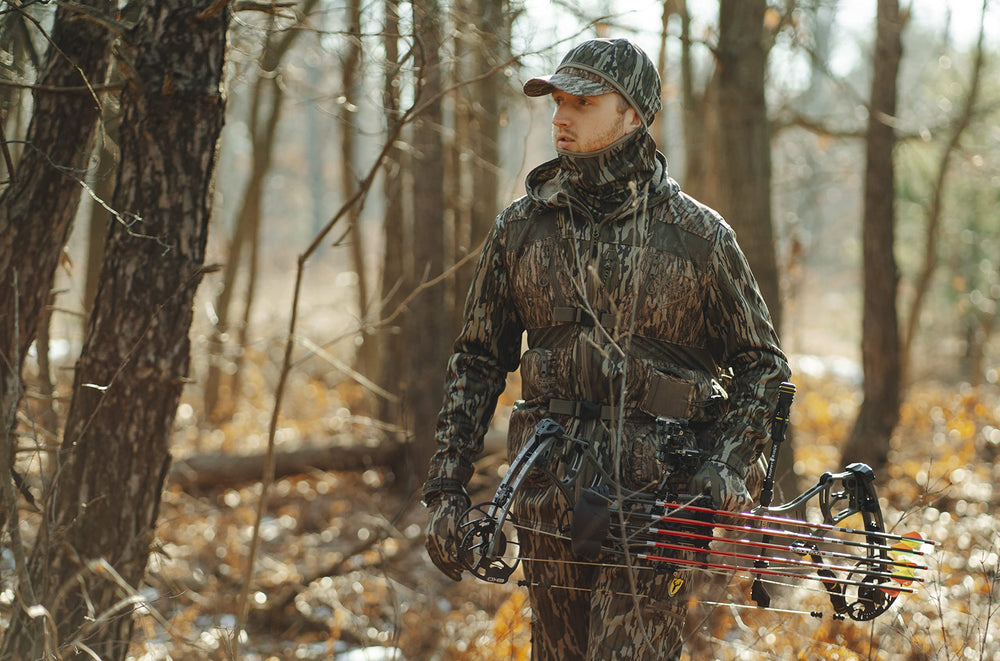 SCENTBLOCKER Shield Series Silentec pants in the woods ready for hunting.