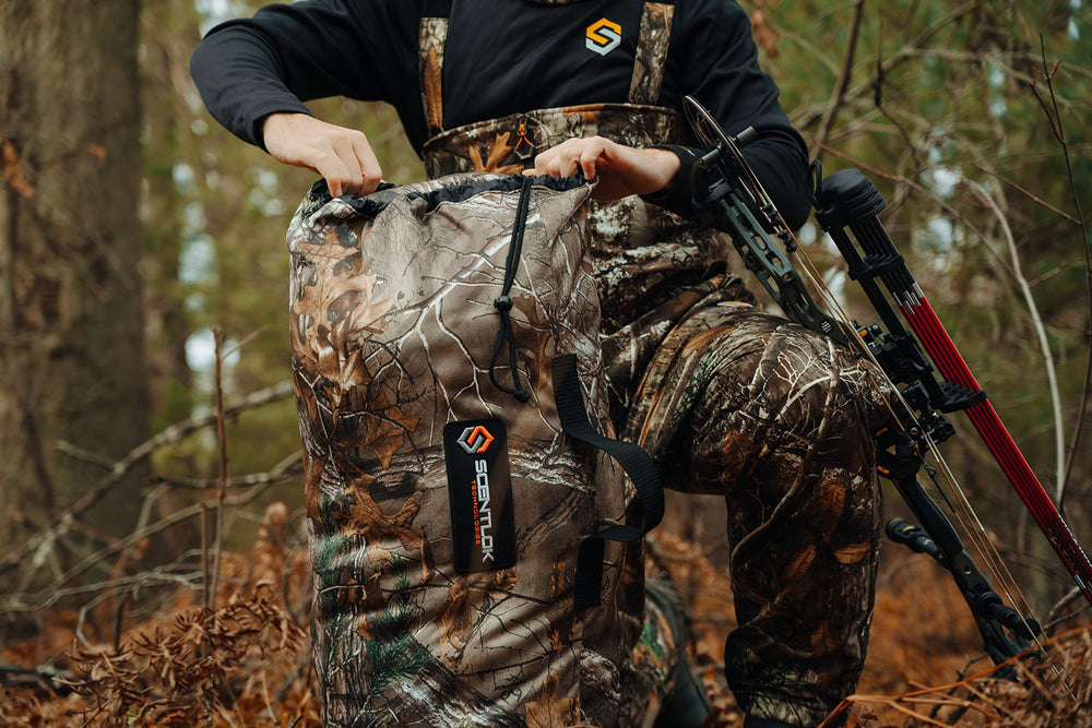 ScentLok Vertigo Grey Duffel shown on rugged terrain during hunting.
