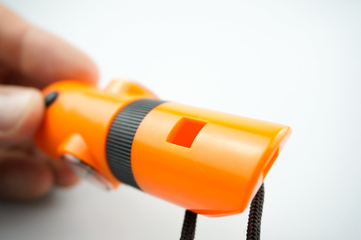 SE 7-IN-1 Survival Whistle built-in compass for trail navigation.