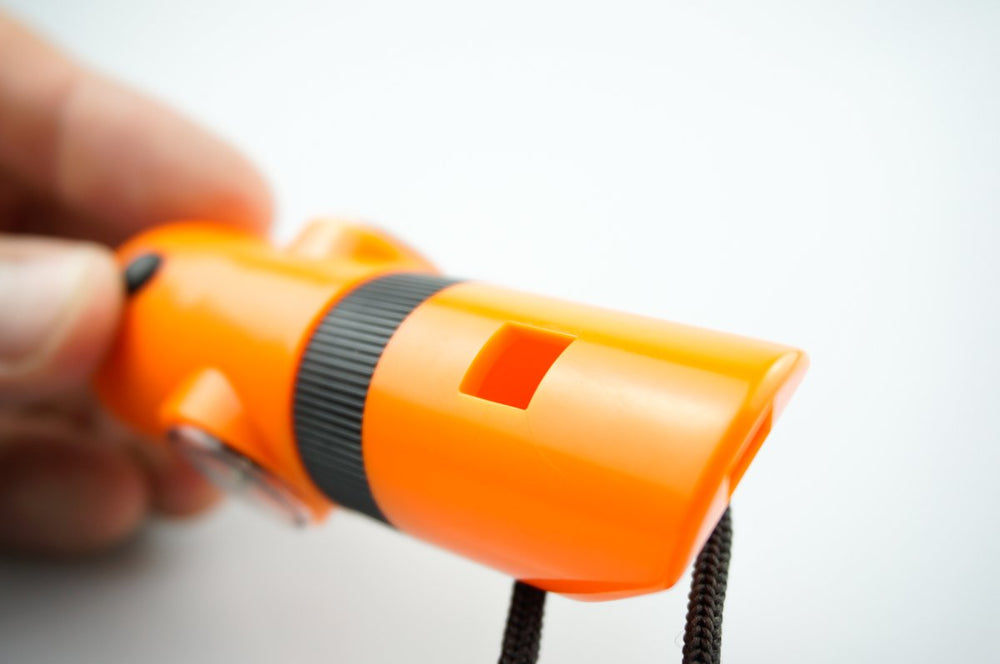 SE 7-IN-1 Survival Whistle built-in compass for trail navigation.