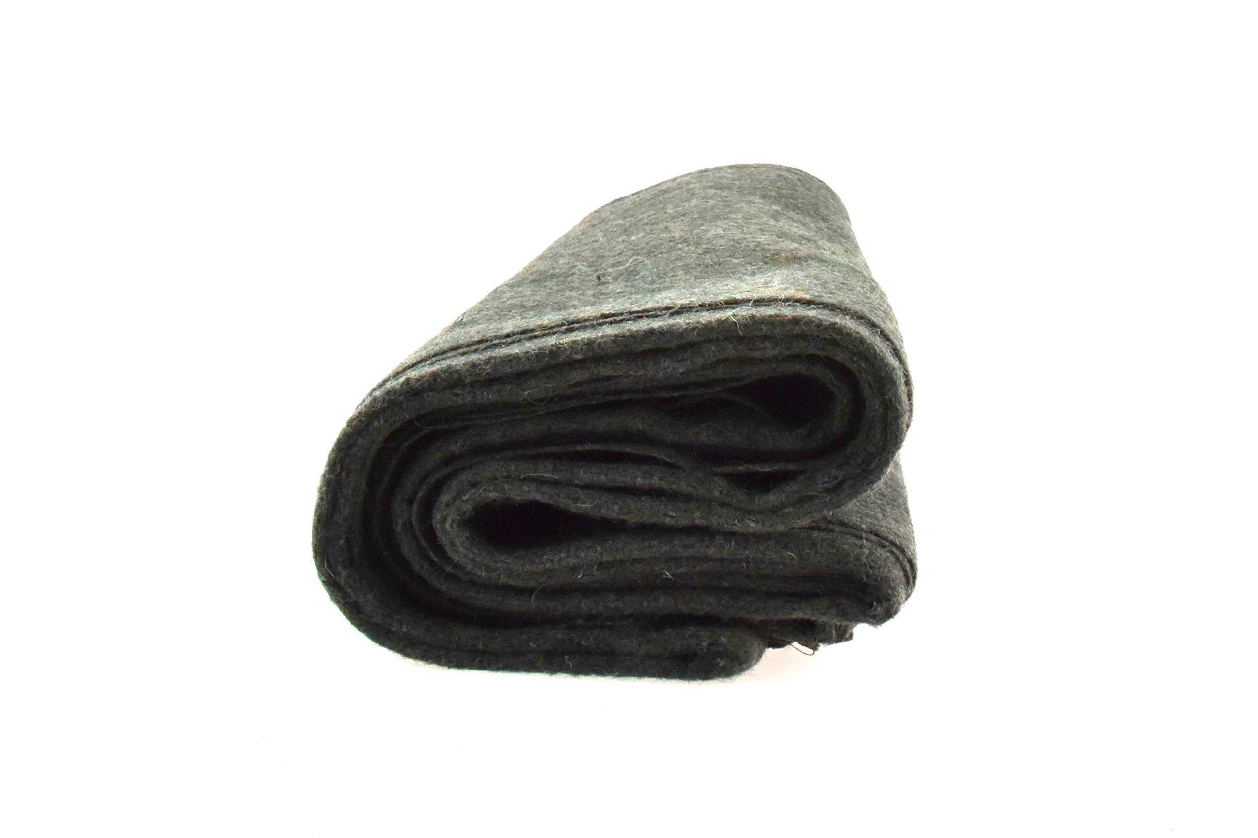SE Green blanket in use during camping for warmth.
