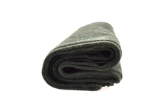 SE Green blanket in use during camping for warmth.