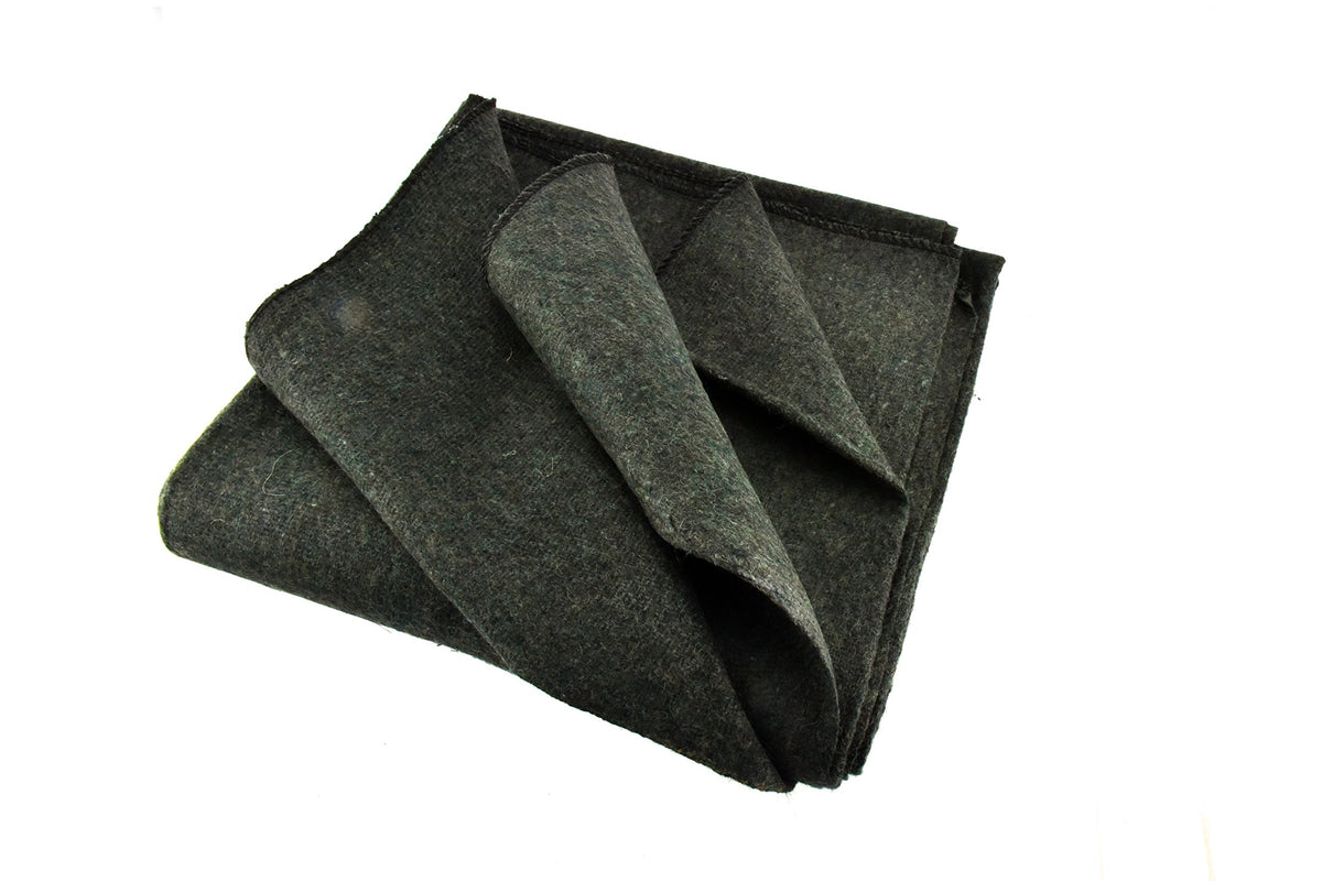 SE Green blanket folded for compact warmth on the go.