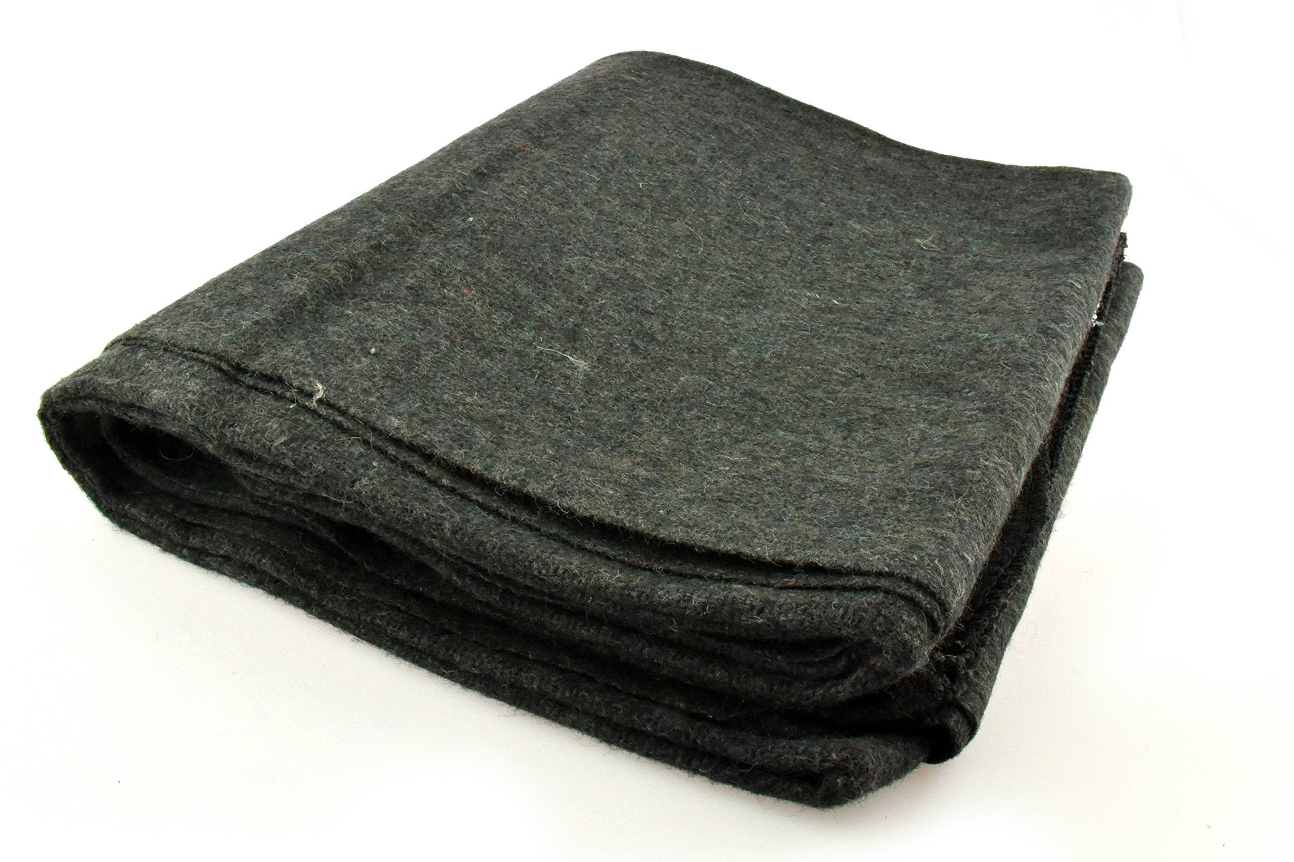 SE Green blanket spread on ground for shelter and comfort.