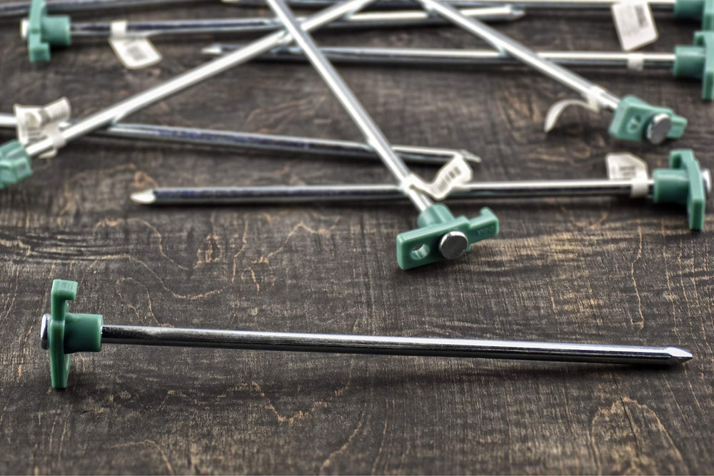 SE heavy-duty tent pegs in dirt demonstrate secure anchoring