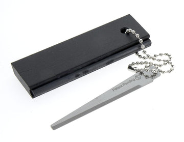 SE firestarter kit featuring flint striker for quick sparks outdoors.