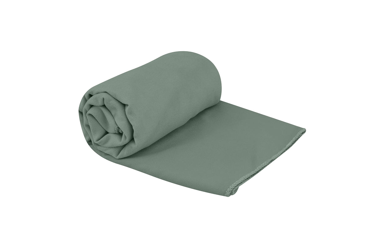 Sea to Summit Drylite Towel folded in Sage Green for compact travel packing.