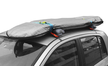 Webbing straps with cam buckles secure gear inside the vehicle.
