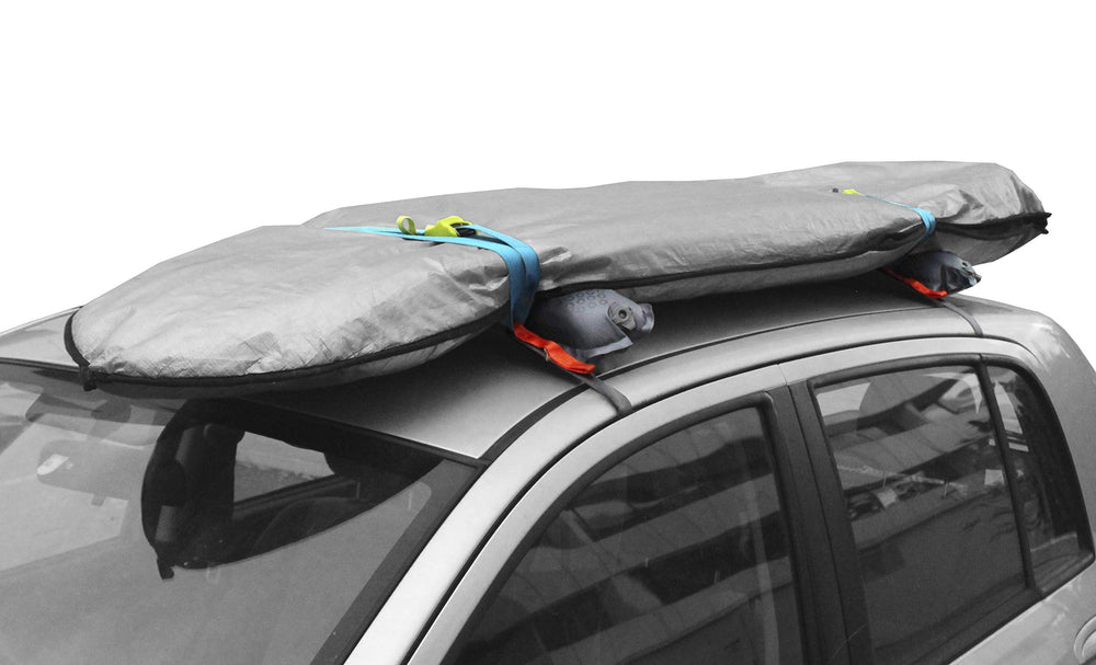 Webbing straps with cam buckles secure gear inside the vehicle.